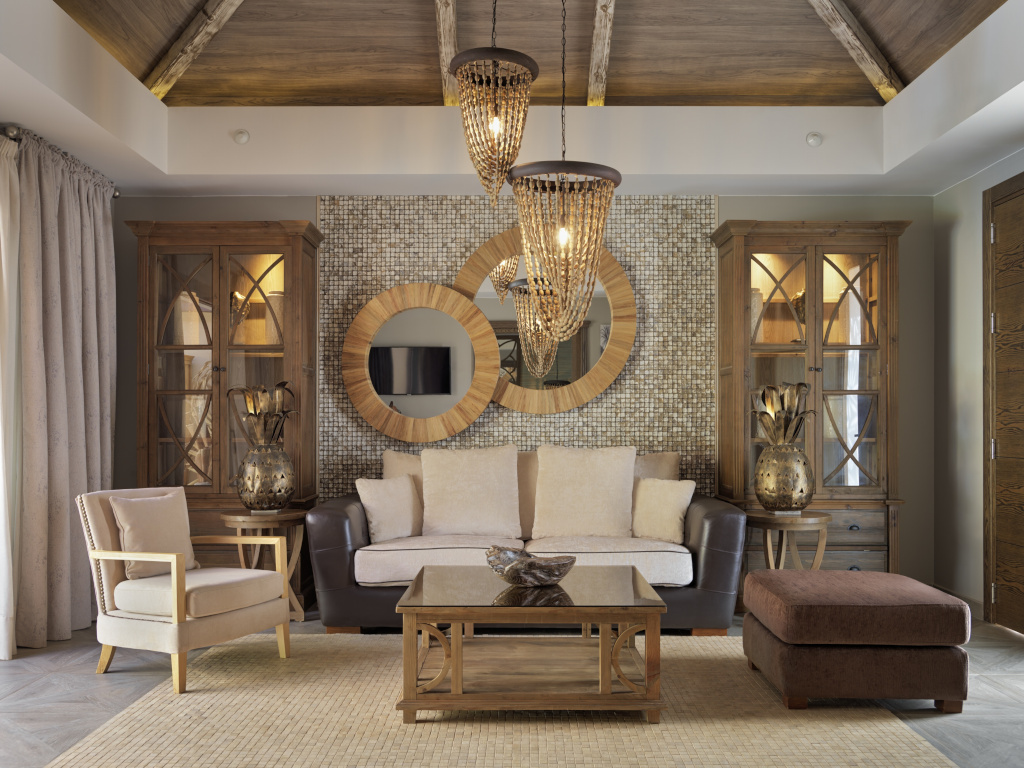 Wohnzimmer mit Sofas, Holzschränken und runden Spiegeln in einem Haus in Tenerife.